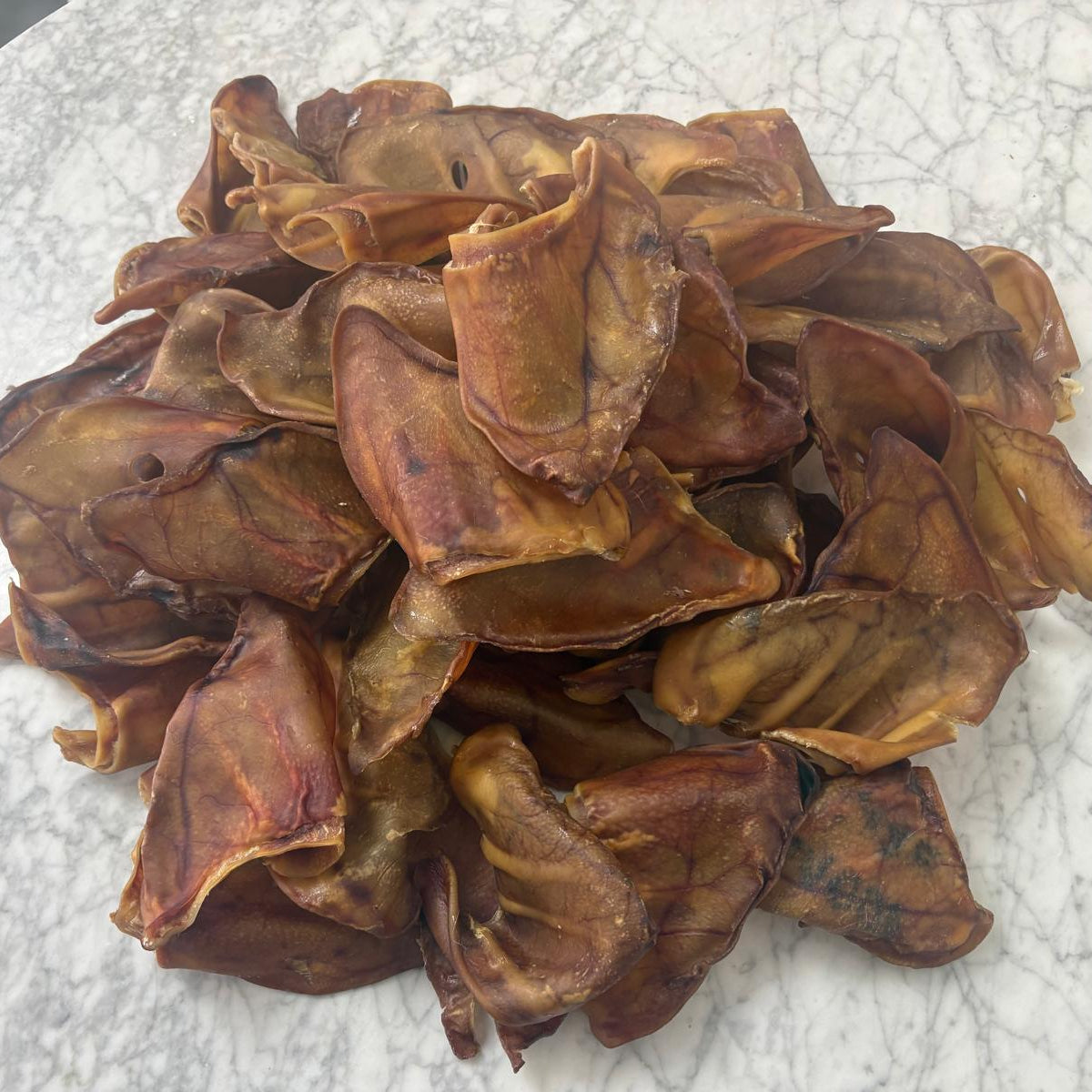 Pile of Extra Large natural dog treats pigs ears